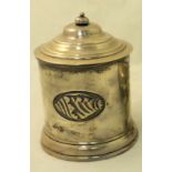An Edwardian silver Tea Caddy of cylindrical form decorated with a shell, with domed cover, London