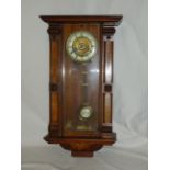 A late 19th Century Vienna type Wall Clock with ivorine dial, the walnut case inlaid with panels