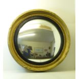 A Regency convex Wall Mirror in ball studded gilt frame, 21" (53cms) diameter overall.