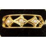 A silver gilt Dress Ring of pierced design set with seed pearls.