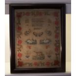 A 19th century Woolwork Sampler by Hannah Woodward 1844, with a prayer, butterfly, swans, stags,