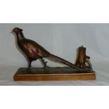 An early 20th century cold painted spelter Table Lighter in the form of a pheasant on an oblong