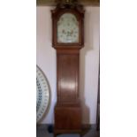 An early 19th century Longcase Clock, the painted arch dial with floral spandrels and inscribed "