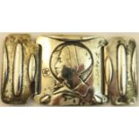 An Edwardian silver Buckle attributed to Kate Harris, in three sections, the centre decorated with a