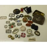 A Tin with the badge of the Durham Light Infantry and Contents of various military buttons, and a