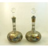 A pair of American silver overlaid glass Sherry Decanters with facet cut stoppers by the Alvin