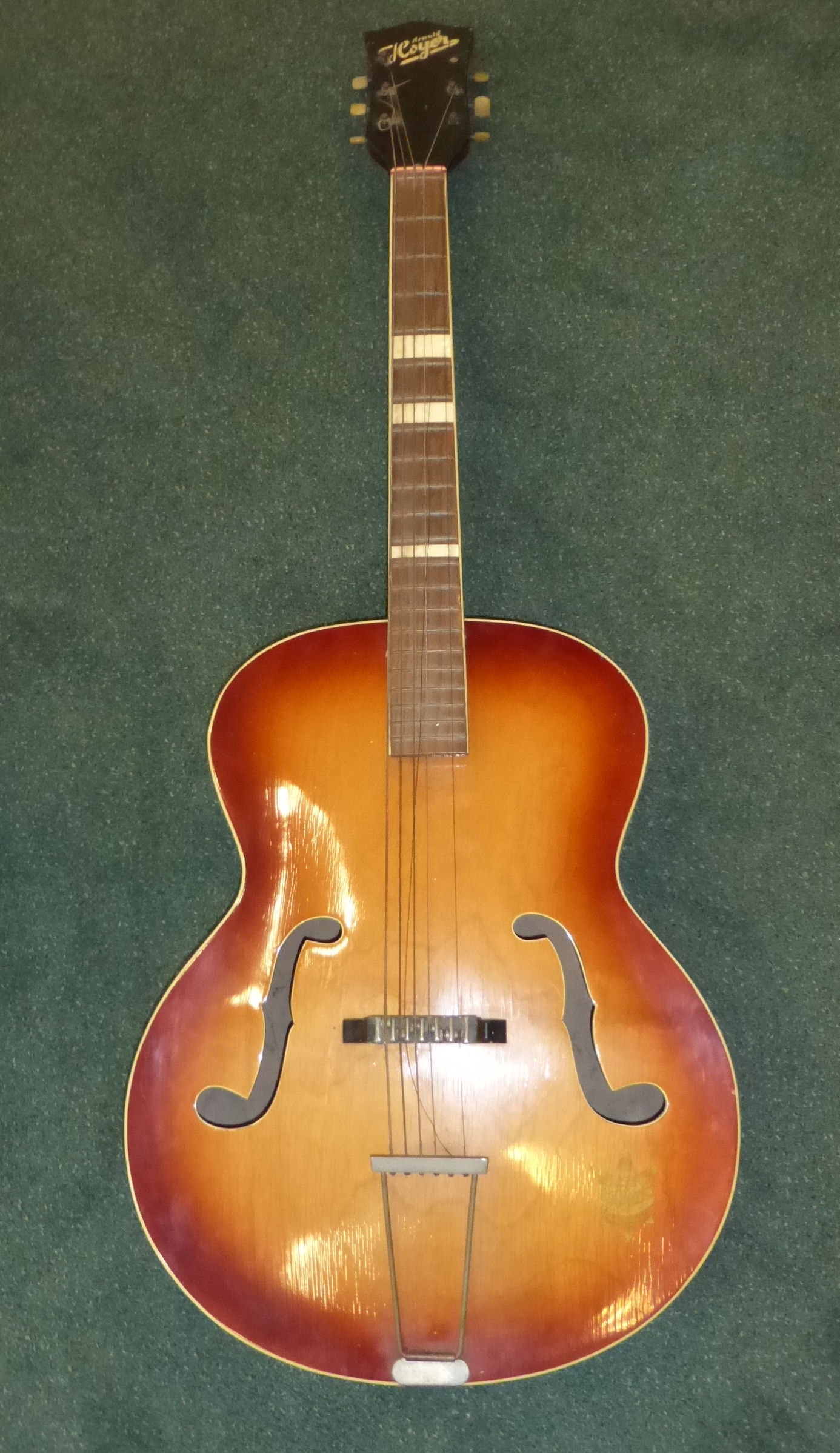 An Arnold Hoyer Acoustic Guitar.