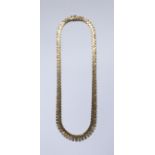 A 9ct. gold three colour Necklace of textured geometric design.  (31.4gms).