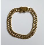 A 9ct. gold filed curb link Bracelet.  (27.1gms).