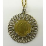 A George III gold Third Guinea, in a gilt metal pendant fitting and on a 9ct. gold neck chain.