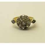 A gold, nine stone, diamond Cluster Ring, with Old European and eight cut diamonds and diamond set