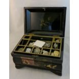 A lacquer Jewellery Box and Contents including a silver hat pin by Charles Horner, a gilt metal