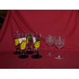 A set of four Kosta Boda Glasses of tapering form designed by Ulrika Hydman-Vallien and painted with