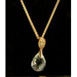 A silver gilt and crystal set Drop Pendant on fine link neckchain.