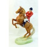 A rare Beswick Model of a Huntsman on a rearing palomino horse, no. 868 second version.