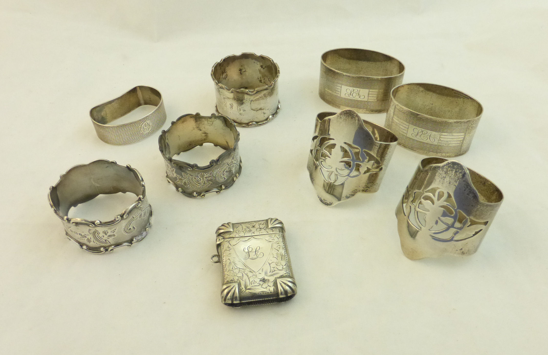 A pair of silver Napkin Rings with pierced decoration, Sheffield 1944; another silver pair with