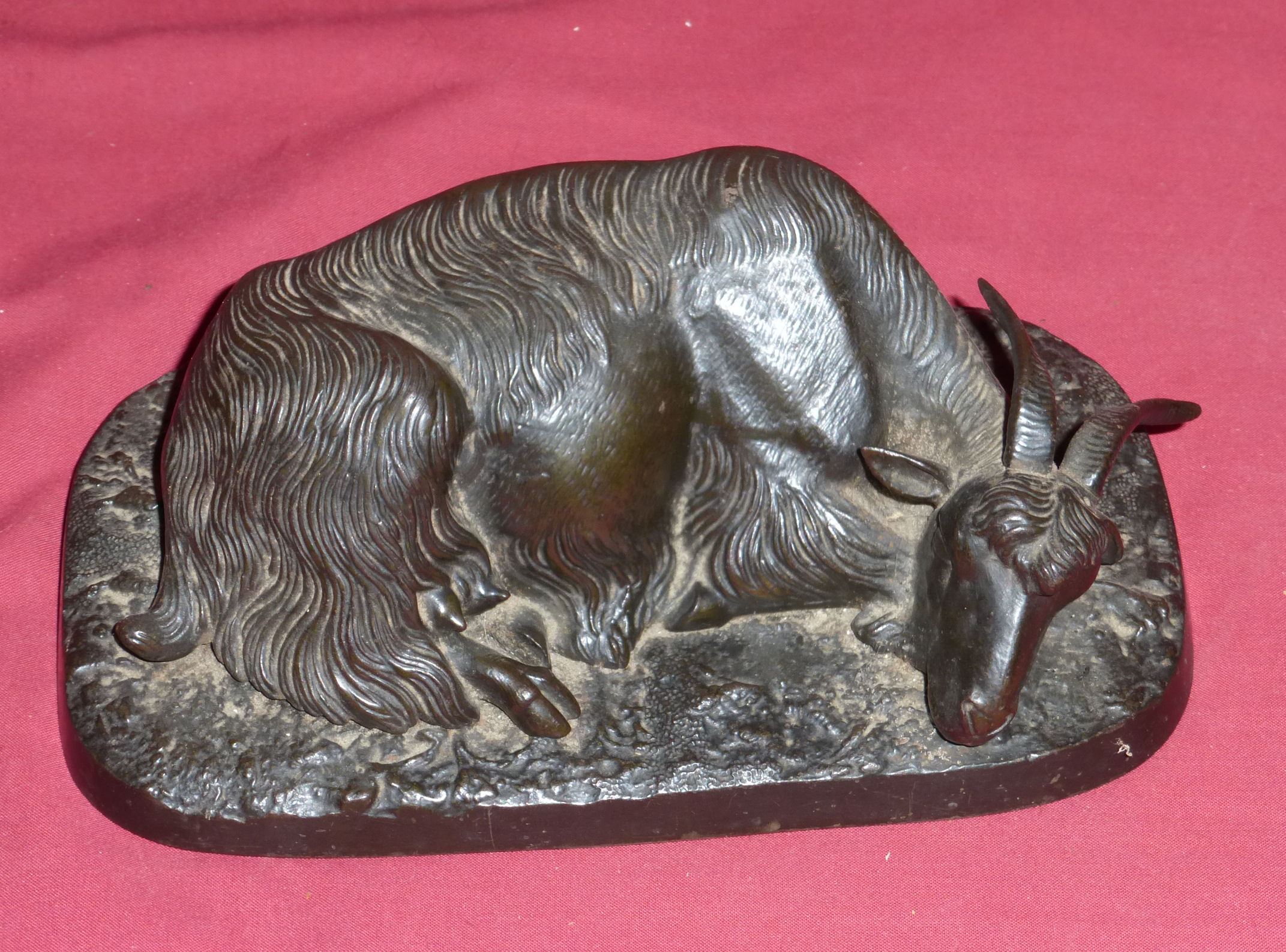 Style of P J Mene, a bronze Figure of a recumbent Goat, 8" (20cms) wide.