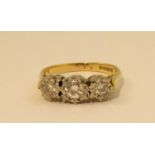 An 18ct gold three stone diamond Ring by Cropp & Farr, the graduated brilliant cut diamonds in