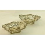 A pair of silver Dishes with flowers, scrolling decoration and pierced panels, Birmingham 1903,