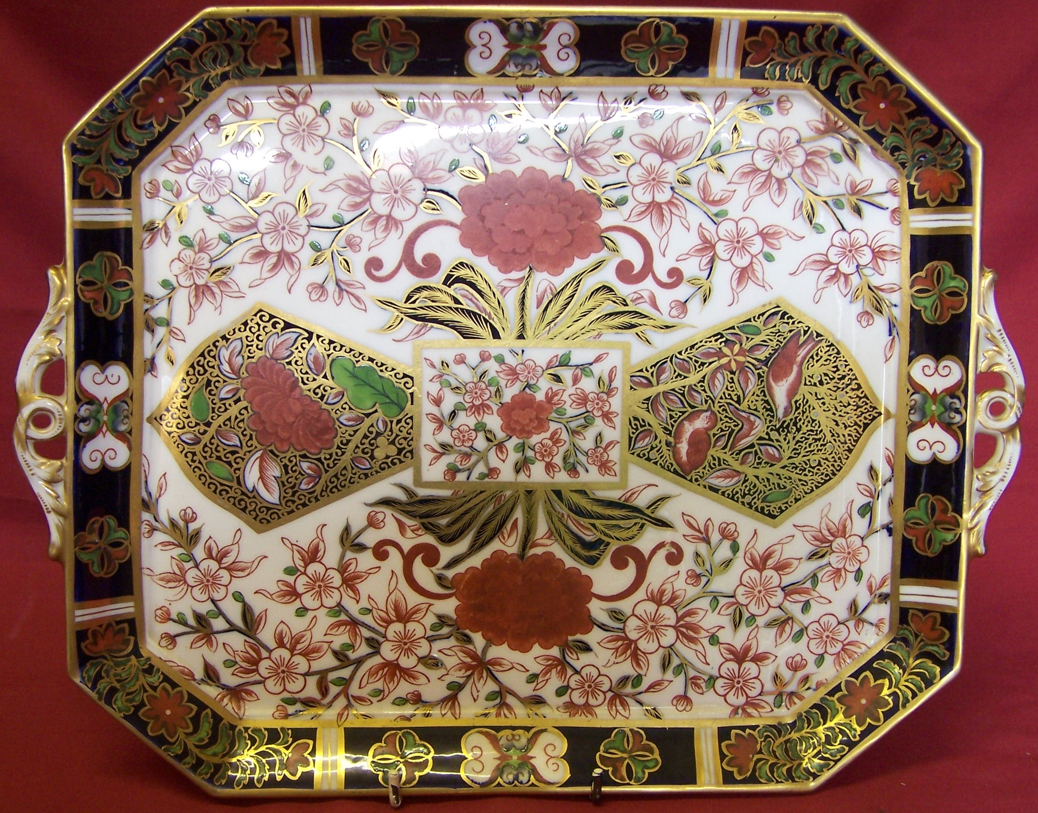 A Victorian Derby oblong two handled Tray decorated with oriental flowers in orange, blue, gilt,