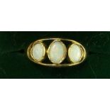 A silver gilt Dress Ring set with three Australian opals.