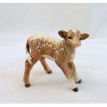 A Beswick Model of a Dairy Shorthorn Calf, no. 1406C, restoration to one ear.