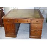A Victorian mahogany and pine Partner's Desk with tooled leather writing surface, each side fitted