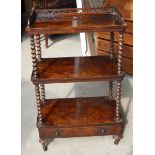 A Victorian figured walnut three tier Whatnot with pierced three quarter gallery, spiral turned