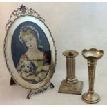 A silver Vase, a silver Candlestick of column design, and a Photograph Frame with pierced floral