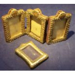 A late Victorian silver folding three division Photograph Frame with embossed decoration, Chester