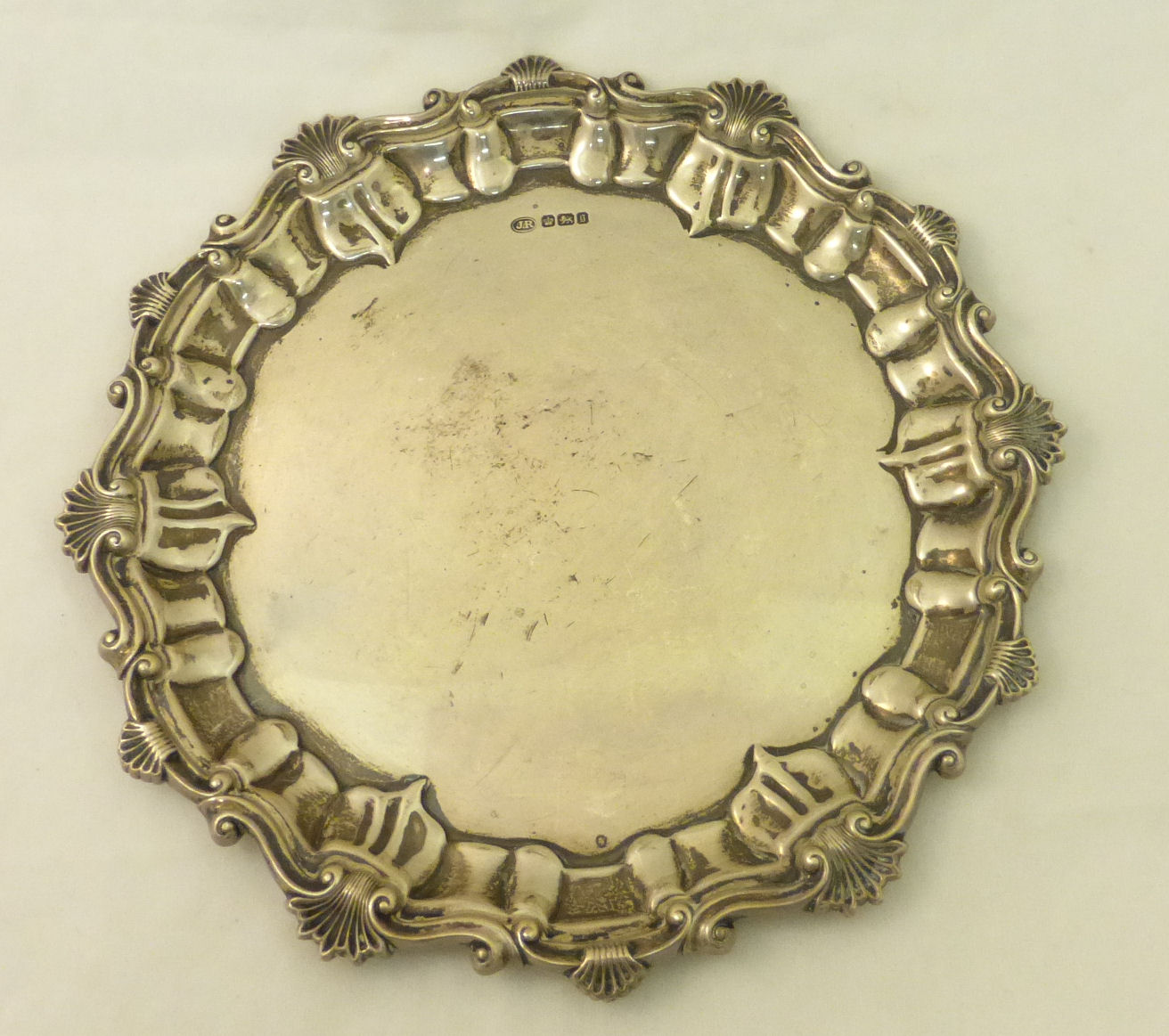 A Victorian silver Dish of shaped circular form with scrolling shell border, Sheffield 1899,