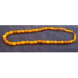 A single row of graduated oblong Amber Beads.