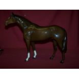 A Beswick model of a large Racehorse in brown gloss, no. 1564.