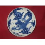 A Chinese blue and white Saucer Dish, painted with a dragon chasing a flaming pearl, Kangxi.  8" (