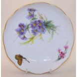 A Meissen Saucer Dish painted with butterflies and flowers on an ozier moulded border, 6 1/2" (