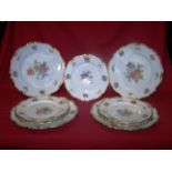 A set of four Dinner Plates by Pauly & Co. of Venice, decorated with floral sprays within a gilt