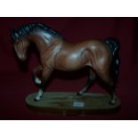 A Beswick model of a brown Horse, 'Spirit of Freedom', on a wooden base in matt finish, no. 2689.