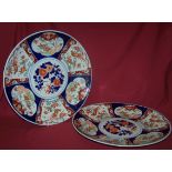 A pair of Imari Chargers decorated with panels of birds and flowers in orange and blue, 16" (