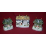 A pair of Staffordshire Pottery Cottage Pastille Burners in the form of two storey cottages and a