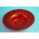 A Whitefriars red glass circular fruit bowl, 27.5 cm diameter, and a set of six wine glasses with