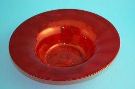 A Whitefriars red glass circular fruit bowl, 27.5 cm diameter, and a set of six wine glasses with