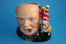 A character jug "Winston Churchill" D6907 colour variation with Union Jack and bulldog handle,