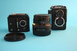 A Lomo Lubitel 2 camera; a Mamiya M645 Super body; a Zenca Bronica SQ-A main camera body; and a