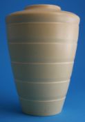 A Wedgwood Keith Murray straw coloured tapering vase with concentric bands, blue printed mark,