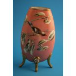 A Victorian glass vase, opaque white overlaid with pale pink, decorated in enamels with a bird on