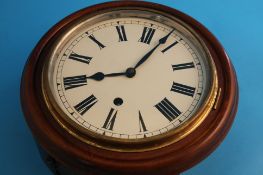 A small modern oak circular wall clock with enamelled dial.19.5 cm diameter dial.