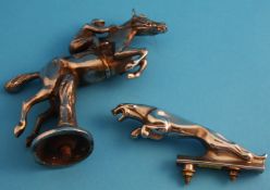 A chrome Jaguar car mascot and a chrome horse and jockey car mascot.12 cm long and 13 cm high