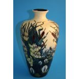 A modern Moorcroft vase of tapering form on a pale yellow ground decorated with water lilies and