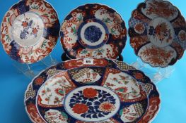 A large Japanese Imari wall plaque and five small plaques.37 cm and various sizes