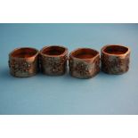 A set of four Oriental silver circular salts, decorated with blossoming branches stamped 90.Weight